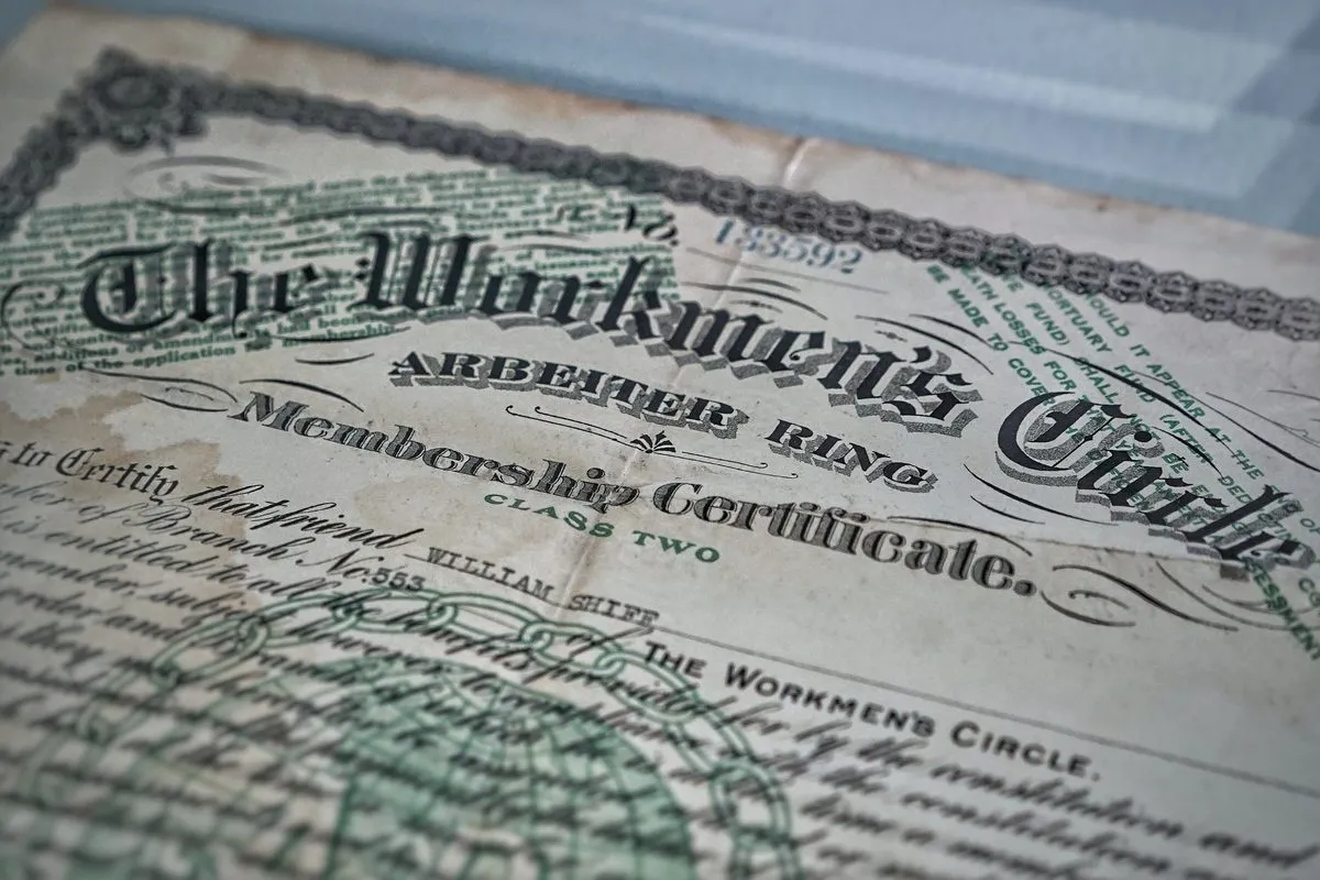 A close-up of an old, ornate membership certificate